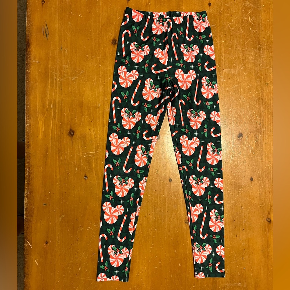 Girls size 6. Disney Christmas leggings.  Candy cane theme.